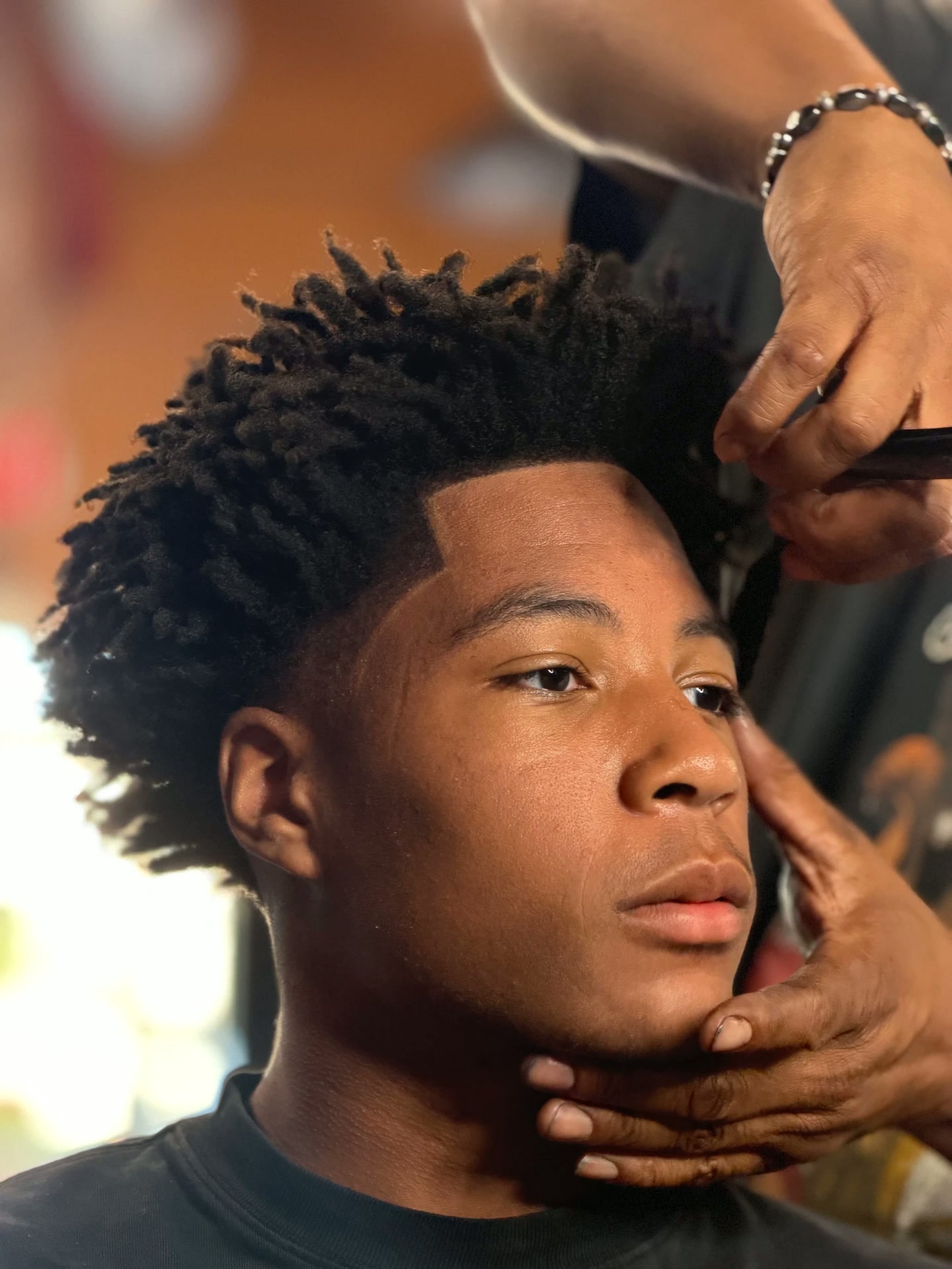 High-top locs fade with a sharp lineup